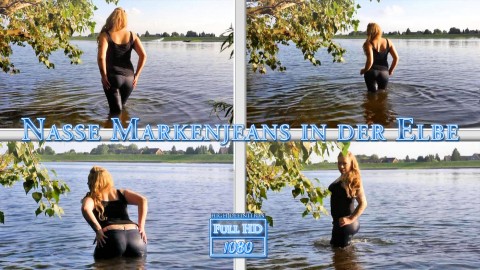 Nasse Markenjeans in der Elbe